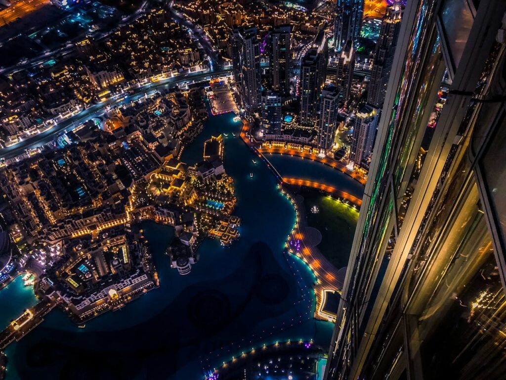 pexels photo 1467300 Vibrant aerial cityscape of Dubai at night with illuminated skyscrapers and urban landscape.