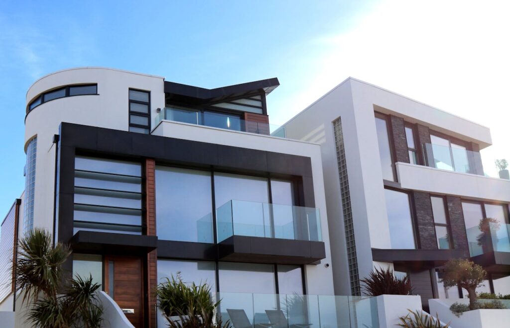 pexels photo 323780 Contemporary luxury home with glass balconies in Poole, UK, showcasing modern architectural design.